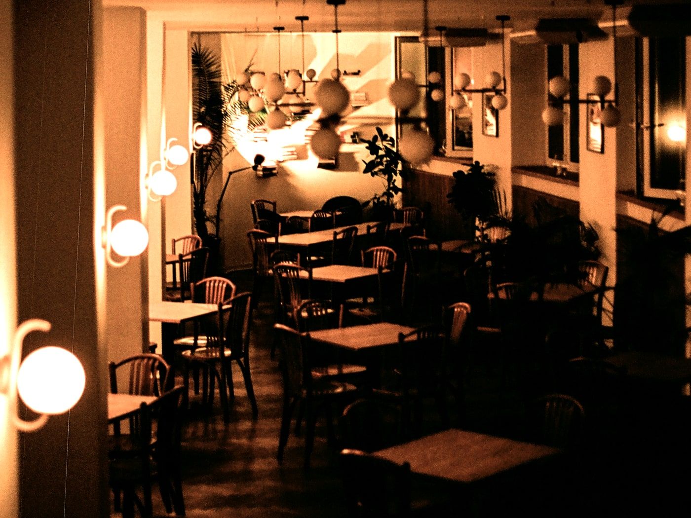 Bentwood chairs and small tables under the wall lamps, most of them empty mid-afternoon.
